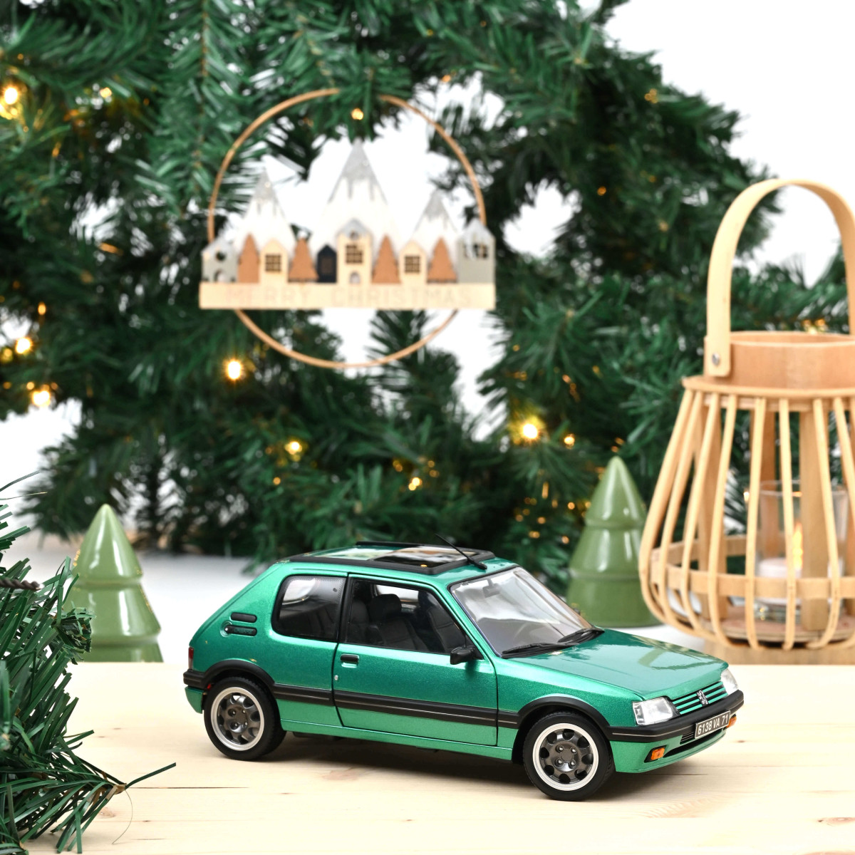 Peugeot 205 Griffe grün 1:18 Norev